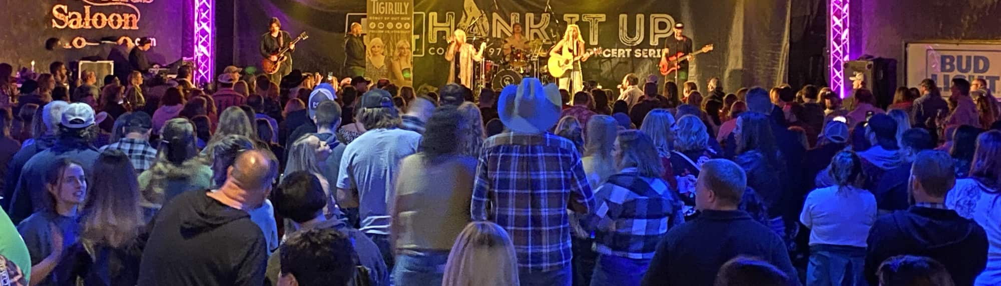 country concert with fans wearing cowboy hats Pittsburgh